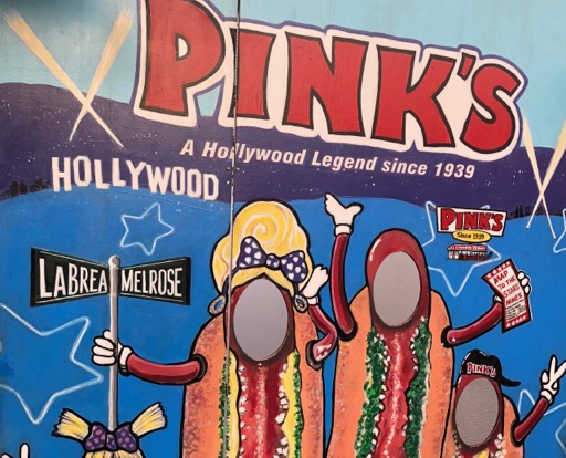 Pink's Hot Dogs hot dog face board