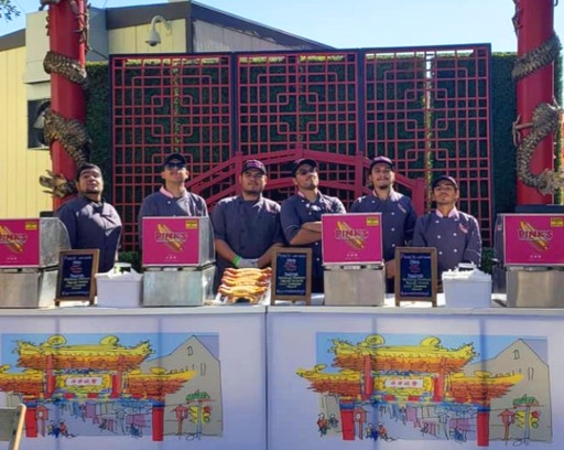 Pink's Hot Dogs team in catering booth