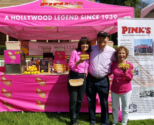 Richard Pink and team in front of Pink's Hot Dogs catering booth
