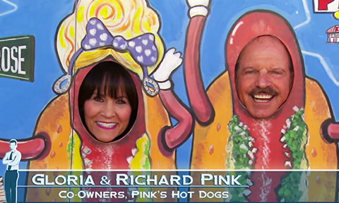 Gloria and Richard Pink posing as hot dogs at Pink's