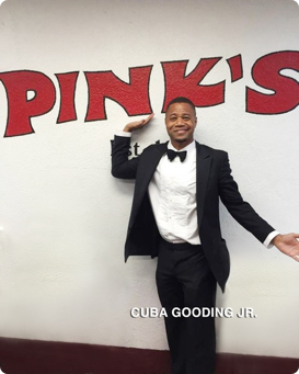 Cuba Gooding Jr. in front of Pink's sign