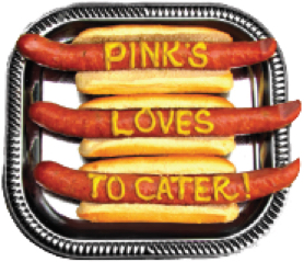 Plate of hot dogs with "Pink's Loves to Cater" spelled in mustard