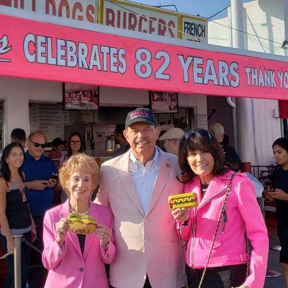 Pink's family in front of store celebrating 82 years