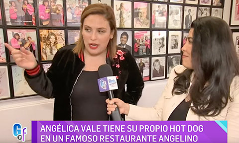 Angélica Vale speaking to camera inside Pink's Hollywood.