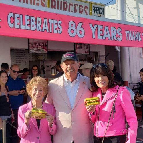 Pink's family in front of store celebrating 86 years.